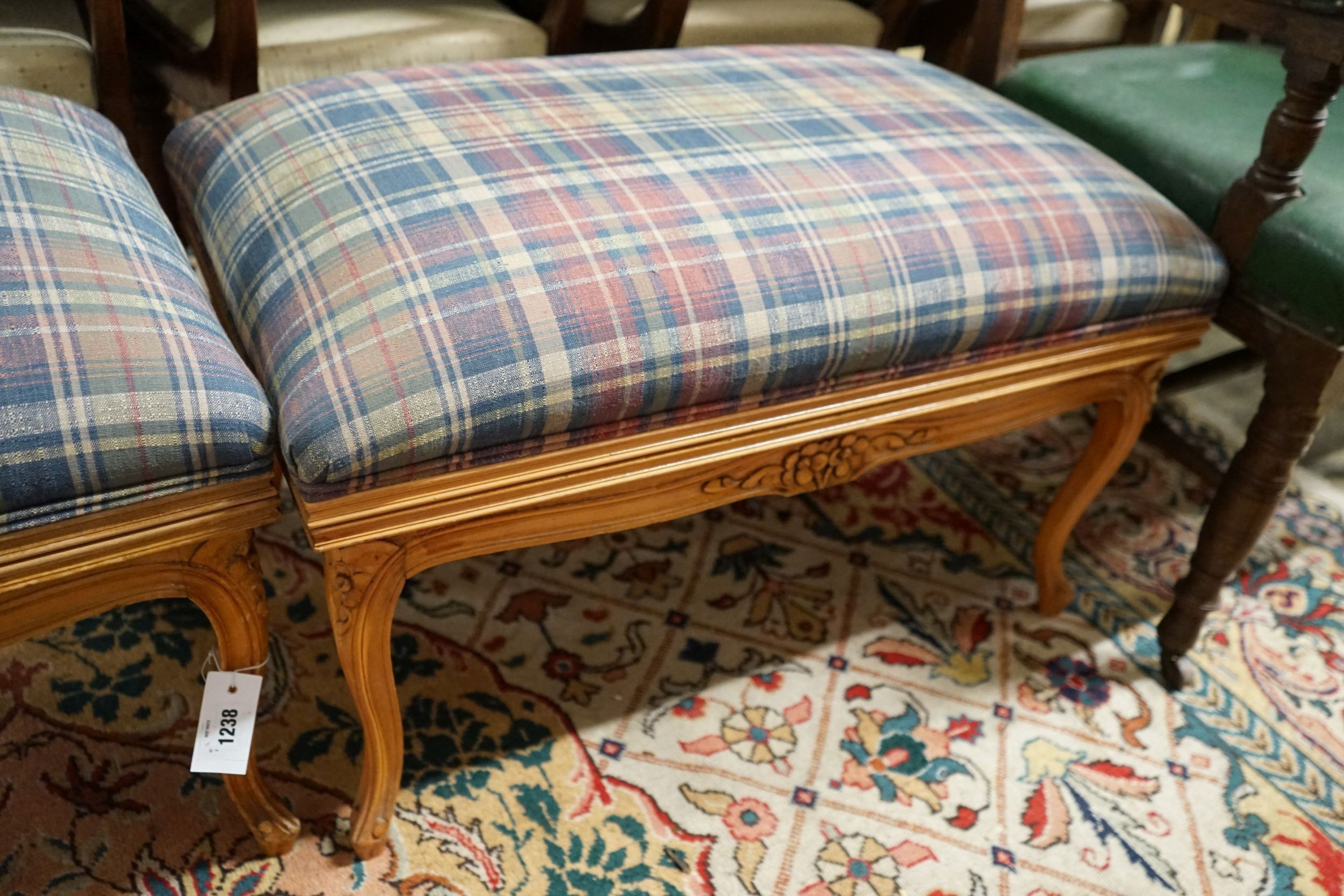 A pair of French carved beech upholstered stools combined luggage racks, width 80cm, depth 50cm, height 46cm